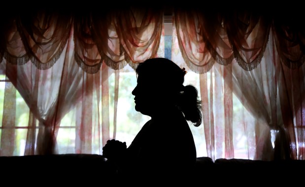 "G.C.," an undocumented immigrant who lives in Orange County and asked to remain anonymous, speaks with the Orlando Sentinel about how the deportation of a relative shattered her sense of home in Florida. (Joe Burbank/Orlando Sentinel)