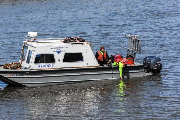 A crew takes water samples from the Lake Michigan at Portage Lakefront and Riverwalk in Portage, Ind., on April 12, 2017. The U.S. Steel plant in Portage released hexavelent chromium, a carcinogen, into the Portage-Burns Waterway about 100 yards from Lake Michigan.