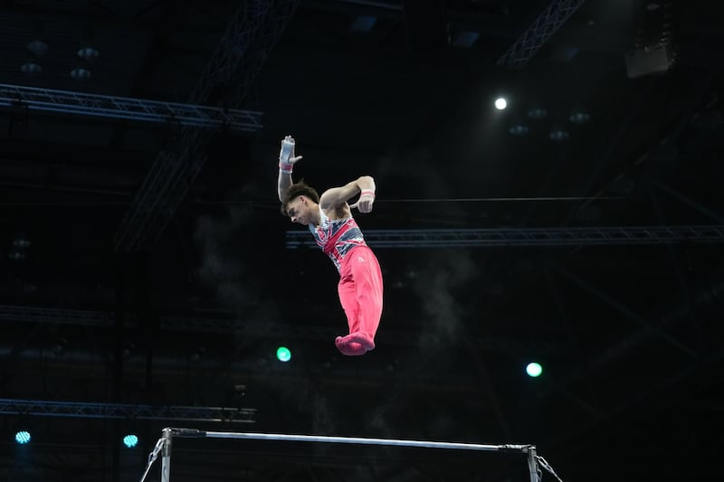 Jonas Rushworth sails high in the air as he performs his routine on the horizontal bar during the 2025 European Artistic Gymnastics Championships in Leipzig, Germany, from May 26 to May 31, 2025.