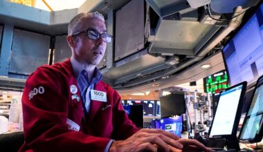 Wall Street hangs near records