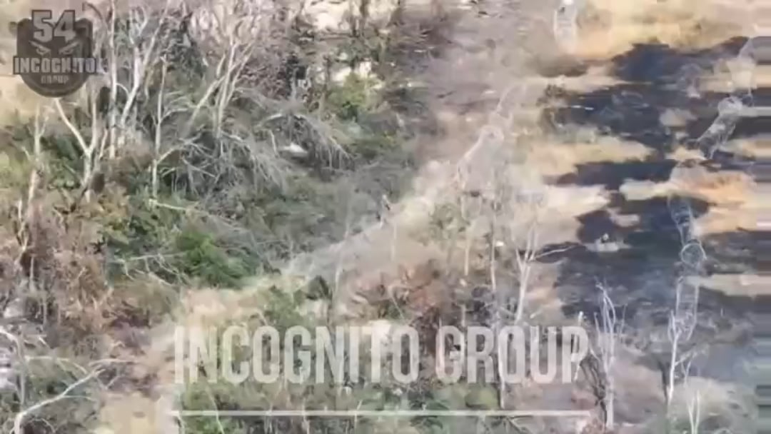 a russian sapper trying to blow a barbed wire obstacle with an anti-tank mine gets hit by fpv, entangled, his mine catches fire and explodes, killing him. NSFW.