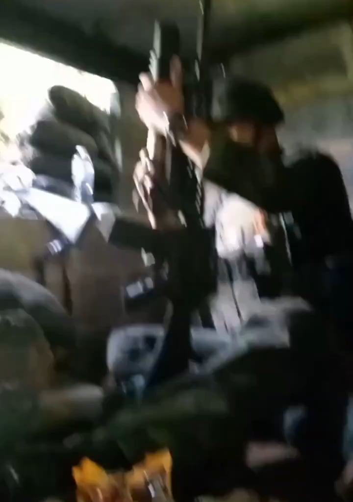 Thai soldiers engage Cambodian positions using M16A4s including an under-barrel 40mm grenade launcher.