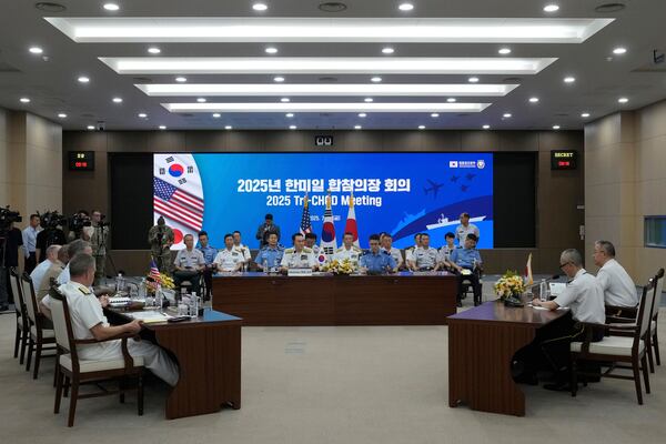 Delegation of South Korea, center, Japan, and the U.S., left, attend a Trilateral Chiefs of Defense meeting at the Defense Ministry in Seoul, South Korea, Friday, July 11, 2025. (AP Photo/Ahn Young-joon, Pool)