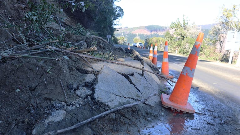 A slip has pushed up the road surface in one location.