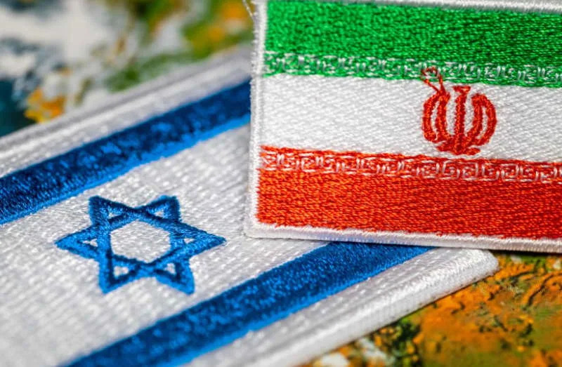 The embroidered flags of Israel and the Islamic Republic of Iran (illustrative) (credit: SHUTTERSTOCK)