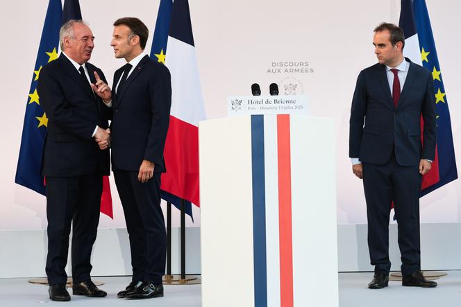 President Emmanuel Macron, alongside the prime minister, François Bayrou, and the minister of the armed forces, Sébastien Lecornu, during the announcement of a new increase in defense spending by 2027, in Paris, July 13, 2025.
