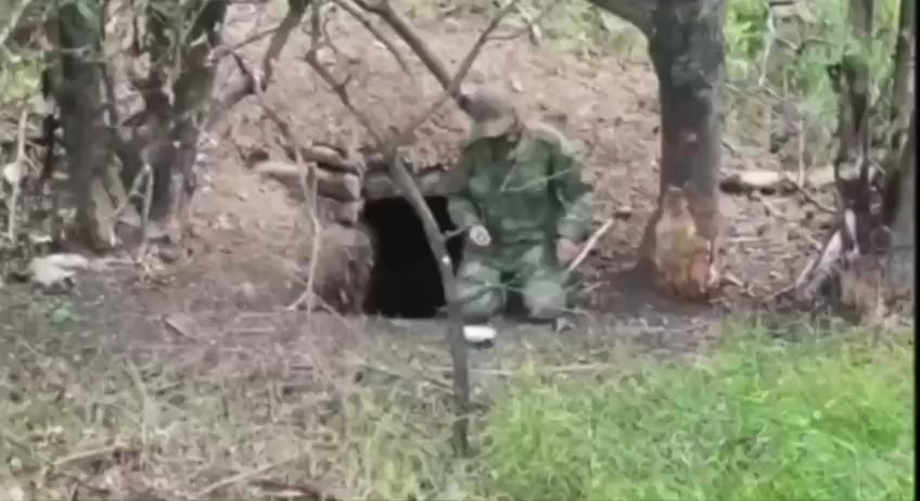 russian soldier fulfills his last decision near his hideout in the way never seen before.  (location and date are not disclosed)