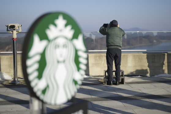 A visitor watched North Korean side at the observatory of the Aegibong Peace Ecopark in Gimpo, South Korea, Friday, Nov. 29, 2024. [AP/YONHAP]