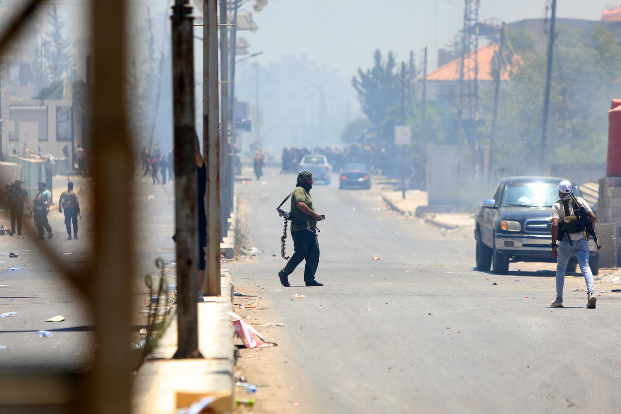 Bedouin tribal gunmen remain on alert against Druze fighters, despite an announcement by the Syrian President of an immediate cease-fire in a neighbourhood in Sweida Syria on July 19, 2025. (AFP Photo)