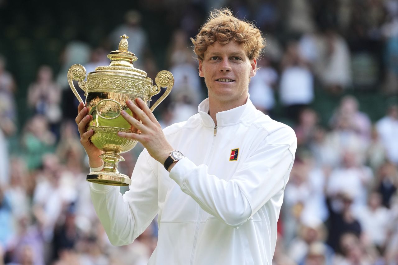 Jannik Sinner poses with his trophy after the match.