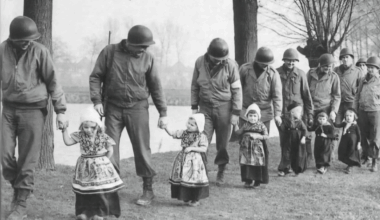 Dutch girls escorting American soldiers to a dance (after ww2)