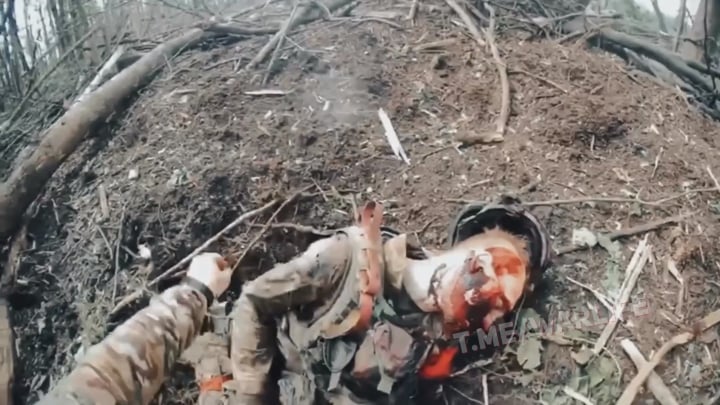 Ukrainian special forces finish off and collect trophies from a Russian assault group destroyed in close combat.