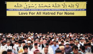 Members of the Ahmadiyya Muslim community are led in prayer