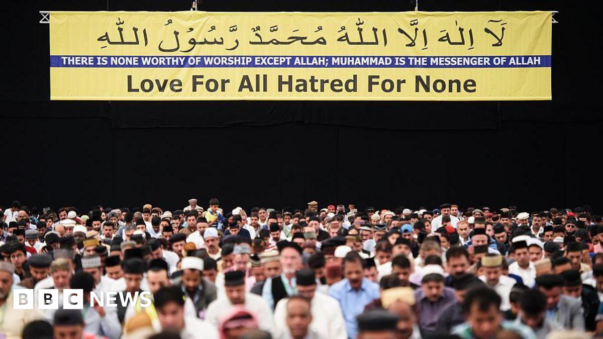 Members of the Ahmadiyya Muslim community are led in prayer