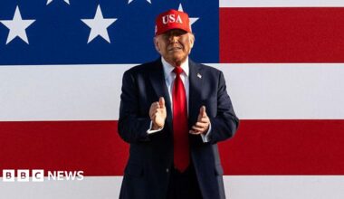 US President Donald Trump claps as he arrives to speak at the Salute to America Celebration at the Iowa State Fairgrounds in Des Moines on 3 July, 2025.