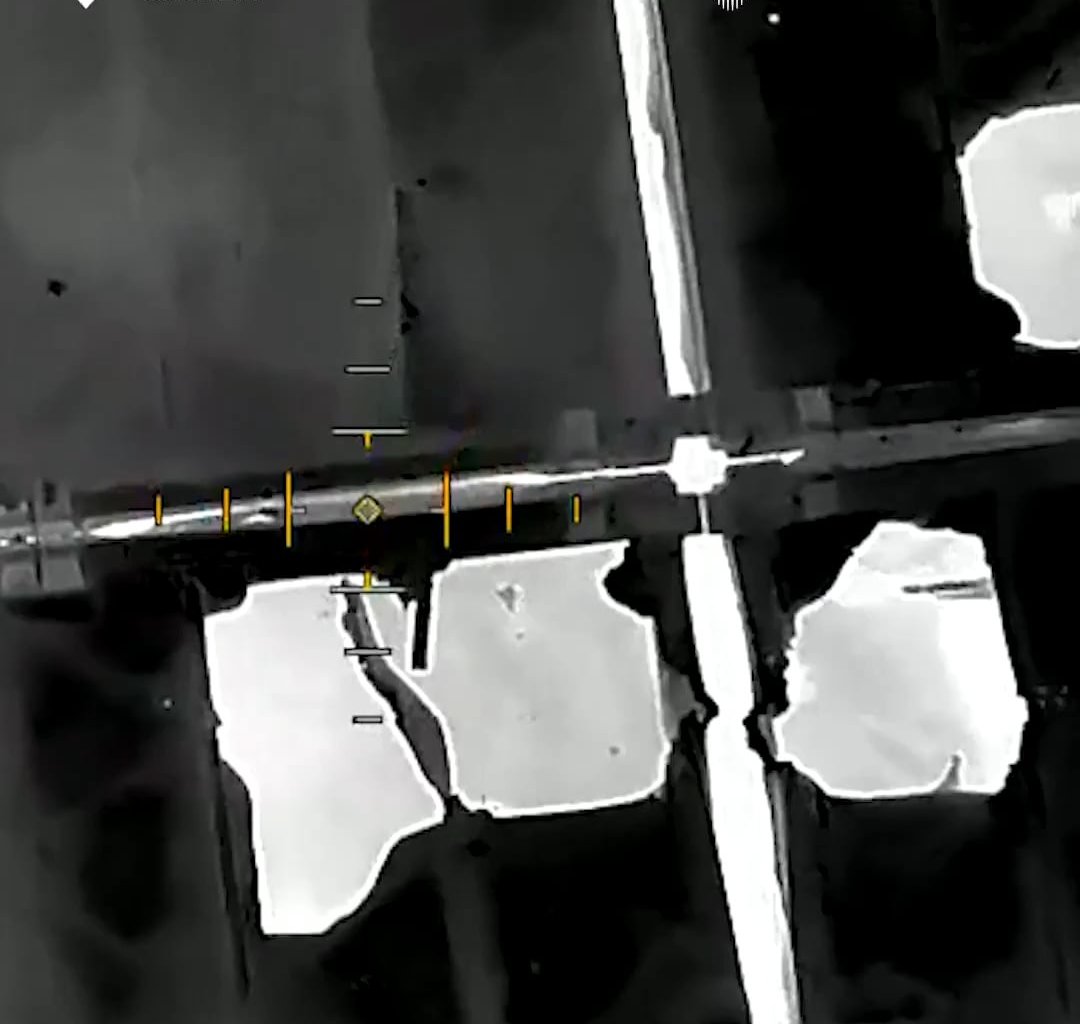 A Ukrainian drone operator drops a charge through a small hole in a Russian pontoon bridge to blow it up from the inside.