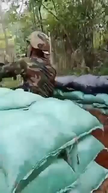 Royal Cambodian Army soldiers exchanging fire with Royal Thai Army at border positions.