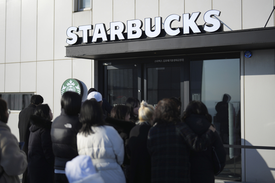 Visitors wait to enter at newly opened Starbucks store at the observatory of the Aegibong Peace Ecopark in Gimpo, South Korea, Friday, Nov. 29, 2024. [AP/YONHAP]
