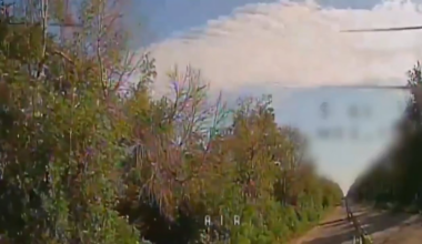Ukrainian fpv drone expertly flies under a net and through branches to hit a russian hiding in a trench