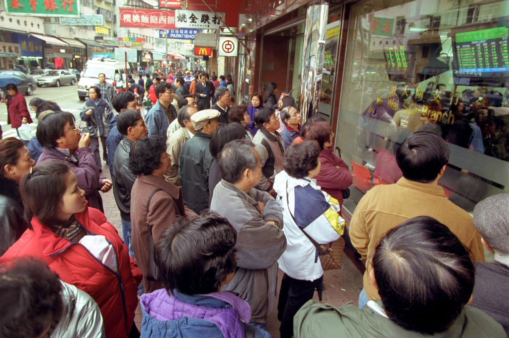 Investors gather outside a local bank in Hong Kong to check the latest share price of tom.com during its first day of trading on March 1, 2000, at the height of the dotcom boom. Photo: SCMP Pictures Investors gather outside a local bank in Hong Kong to check the latest share price of tom.com during its first day of trading on March 1, 2000, at the height of the dotcom boom. Photo: SCMP Pictures