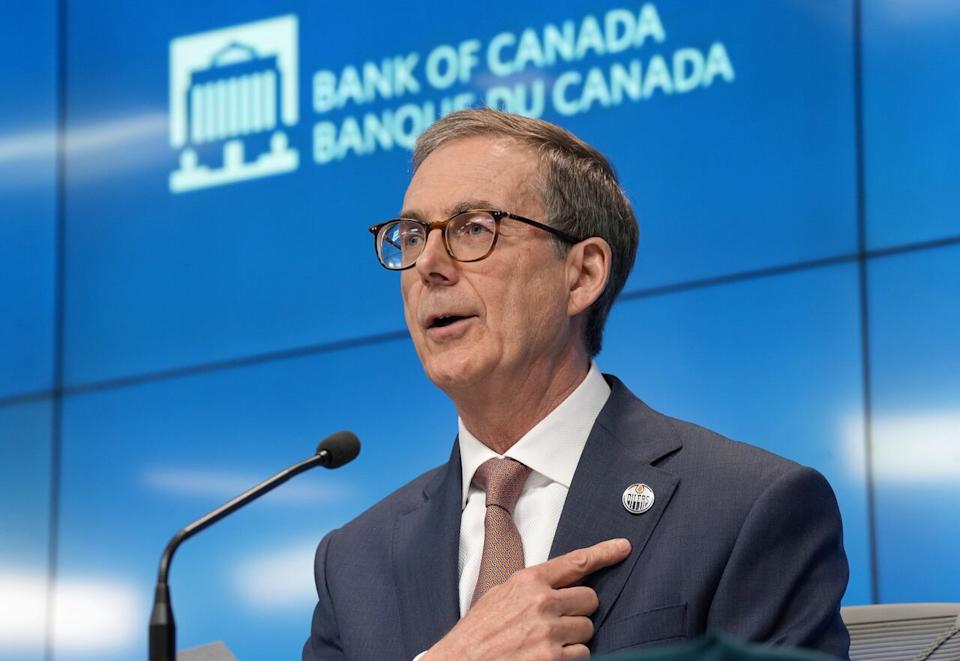 Bank of Canada Governor Tiff Macklem points to his Edmonton Oilers pin as he voices his support for the team in the Stanley Cup final during a news conference, in Ottawa.
