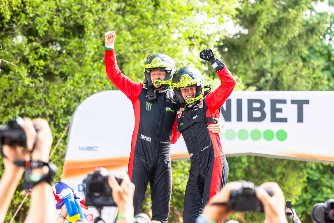 Swede Oliver Solberg (right) and his British co-driver Elliott Edmondson celebrate on the podium after winning the Rally Estonia, the eighth round of the FIA World Rally Championship, on July 20, 2025 in Kaariku.