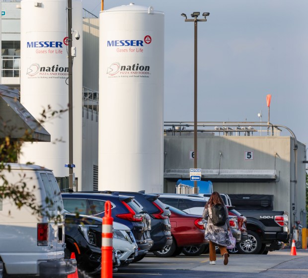 Workers head into work at Nestlé owned Nation Pizza and Foods in Schaumburg, on July 23, 2025. (Stacey Wescott/Chicago Tribune)