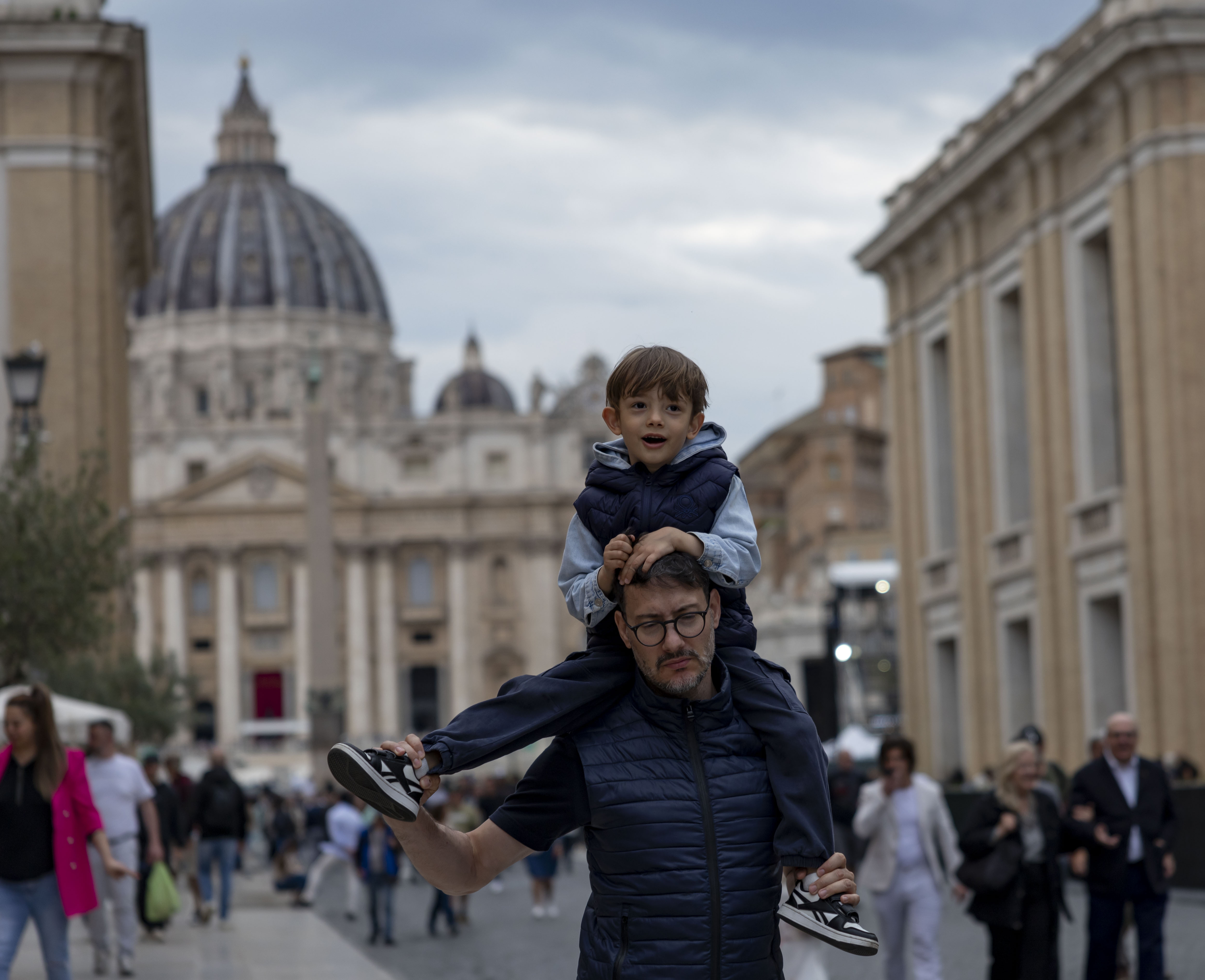 People visit St. Peter's Square on Thursday, May 15, 2025, before the installation of Pope Leo XIV at the Vatican. (Brian Cassella/Chicago Tribune)