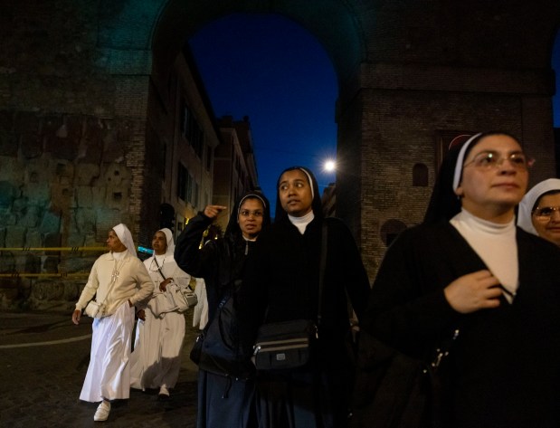 Nuns arrive before dawn to see Pope Leo XIV installed during Mass in St. Peter's Square on Sunday, May 18, 2025, at the Vatican. (Brian Cassella/Chicago Tribune)
