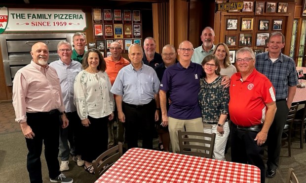 Pope Leo XIV, formerly Cardinal Robert Francis Prevost, center in light blue shirt, visited Aurelio's Pizza in Aug. 2024. (Joe Aurelio)