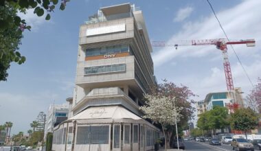 cover Cyprus Business Now: Paphos tourism, Finance Minister, building permits, PwC