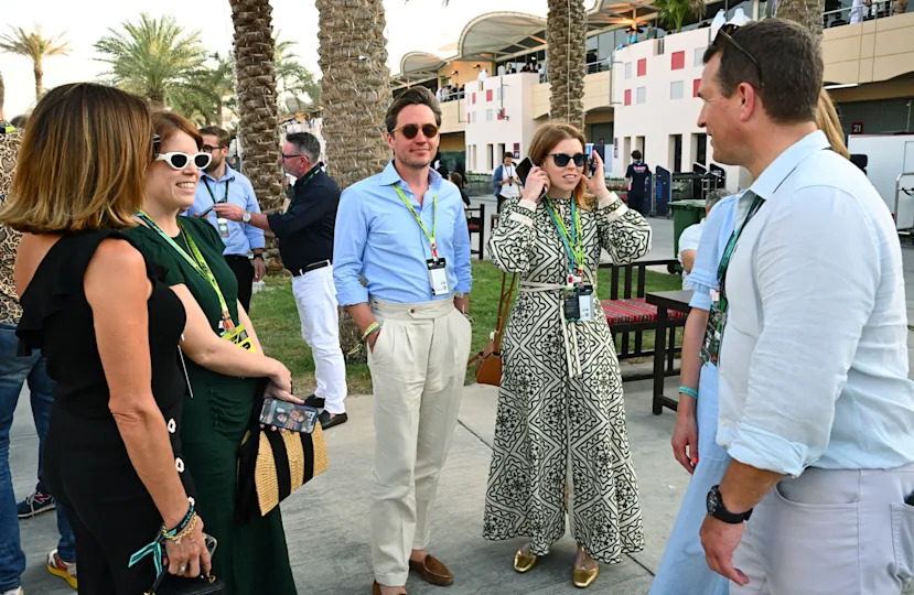 Princess Beatrice, Edo Mapelli Mozzi and Princess Eugenie standing outside at the F1 Grand Prix 2025