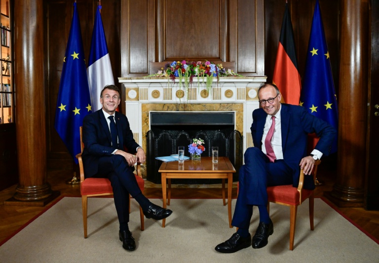 German Chancellor Friedrich Merz and French President Emmanuel Macron at the Villa Borsig in Berlin (John MACDOUGALL)