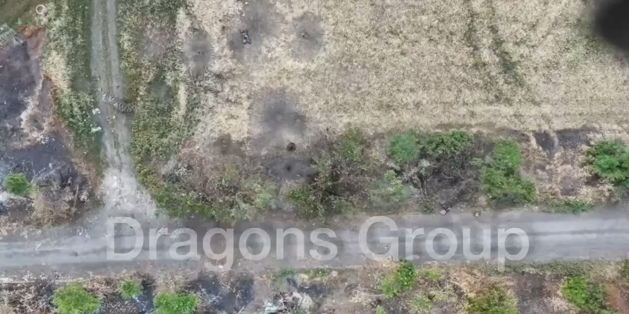 A Russian in his underwear has a grenade explode near him, the drone then watches him do the walk of shame back towards Russian lines.