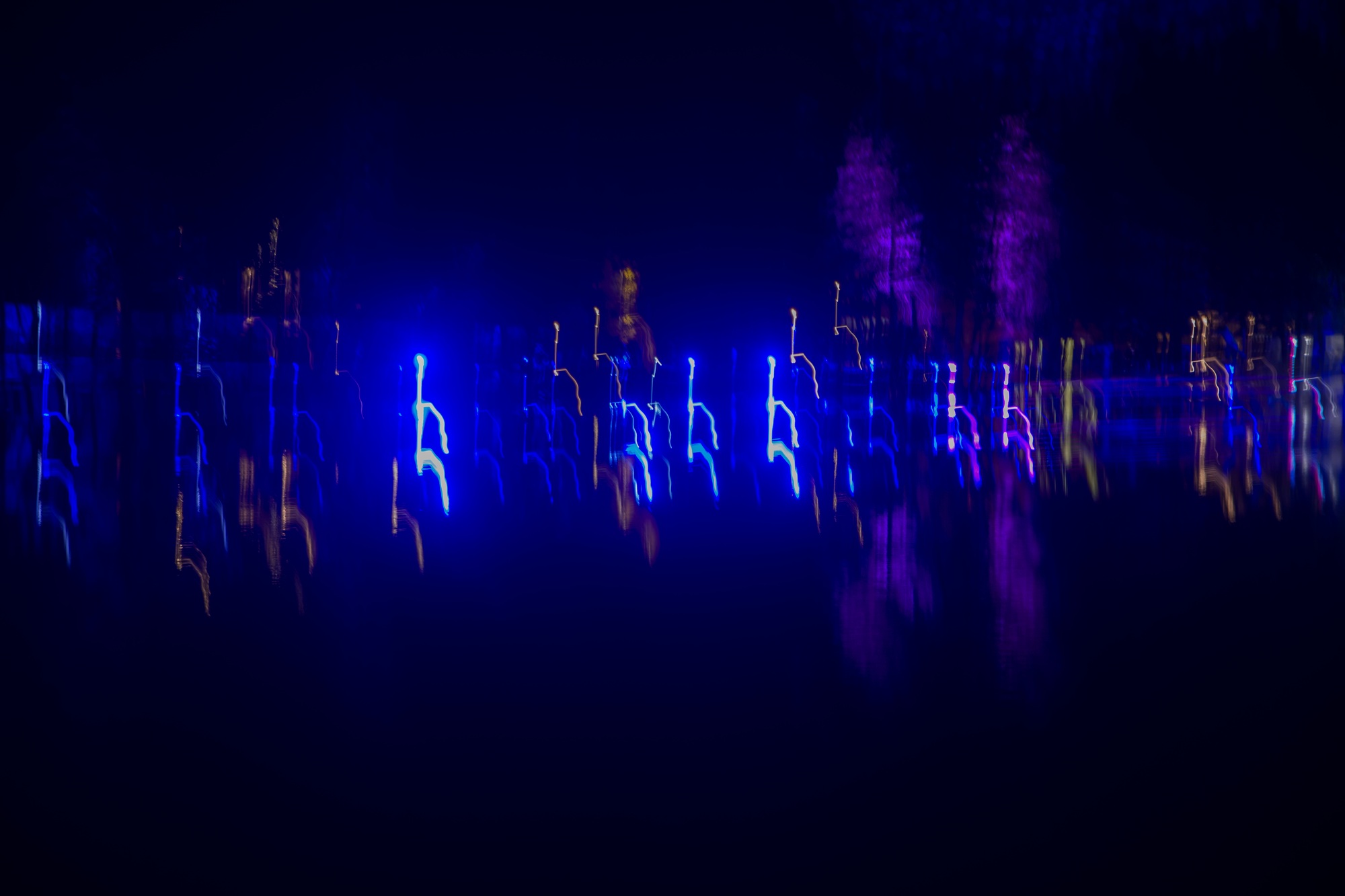 data visualization, neon blue and purple long exposure lights in night darkness
