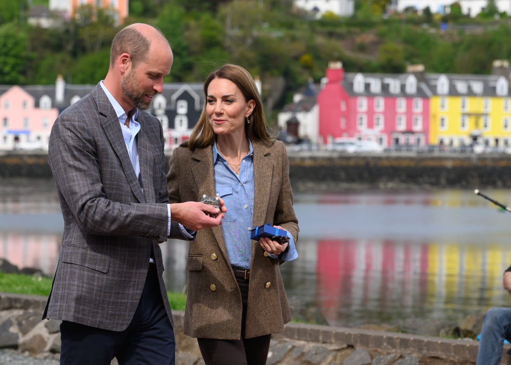 Prince William and Kate Middleton walking by the coast