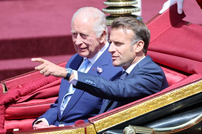 King Charles III and President of France, Emmanuel Macron on a state drive to Windsor Castle on July 08, 2025 in Windsor, England.