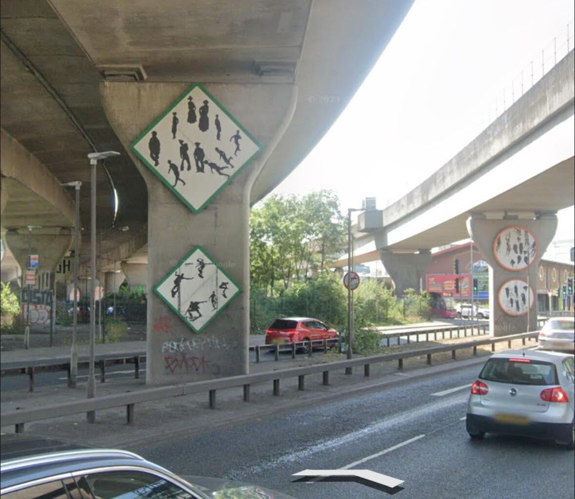 What in the living world do these signs mean on the M2 exit heading towards Nelson Street?