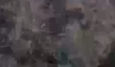 Russian soldier pushing out injured comrade from the dughout