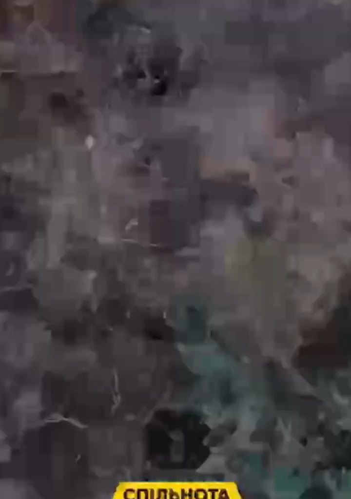 Russian soldier pushing out injured comrade from the dughout