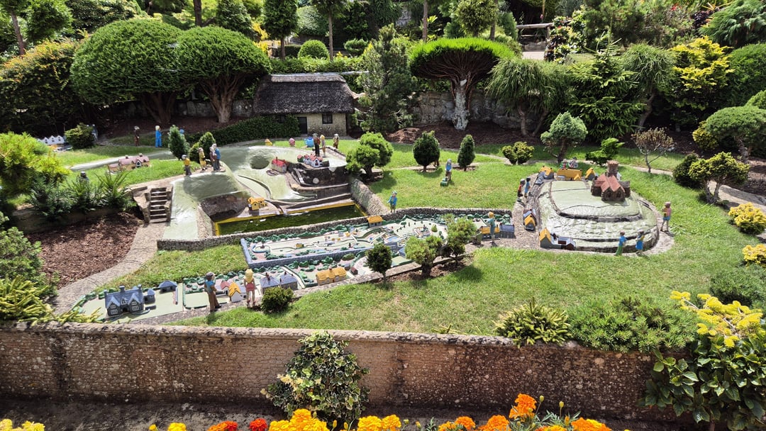 A model village that contains a model of the model village, which itself includes a model of the model of the model village within it.