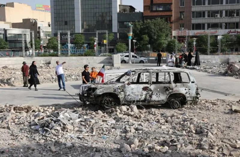 A vehicle burned by Israeli attacks stands on a street, amid the Iran-Israel conflict, in Tehran, Iran, June 23, 2025 (credit: MAJID ASGARIPOUR/WANA (WEST ASIA NEWS AGENCY) VIA REUTERS)