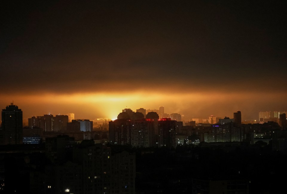 Drone explosion lights up Kyiv night sky.