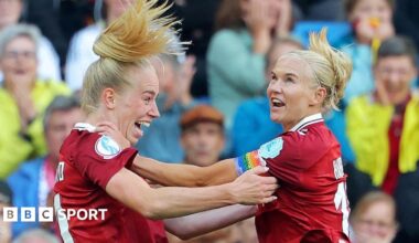 A graphic that reads 'Follow our women's football TikTok' with a picture of a mobile phone