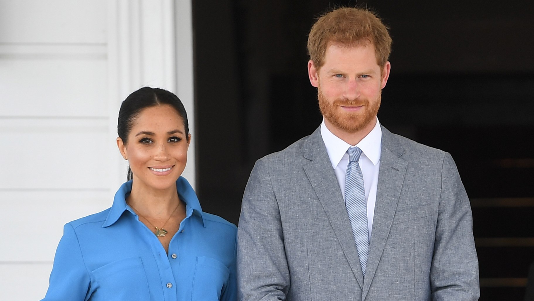 Prince Harry and Meghan, Duchess of Sussex smile during their visit to Tonga in 2018