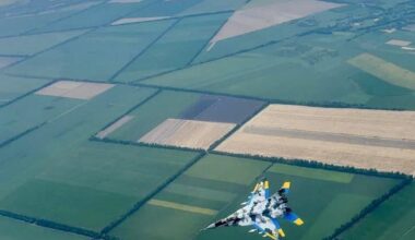 Mikoyan MiG-29 'Fulcrum' multirole fighter jet in digital camouflage with an air-to-air loadout, from the Ukrainian Air Force - over the green countryside of the Poltava Oblast.