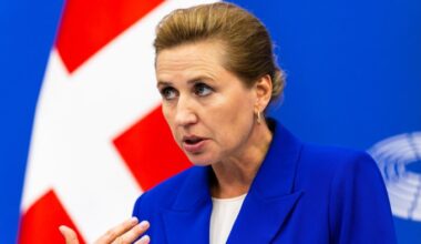 Mette Frederiksen at a news conference, standing in front of Danish flag on July 1 2025