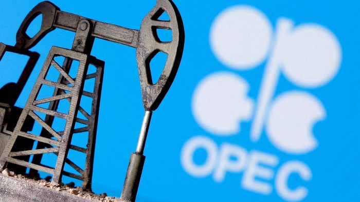 A model of an oil pump jack is displayed in front of the Opec logo