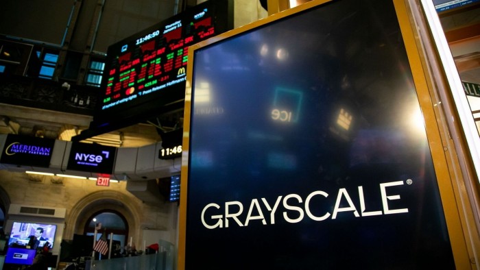 Grayscale signage on the floor of the New York Stock Exchange