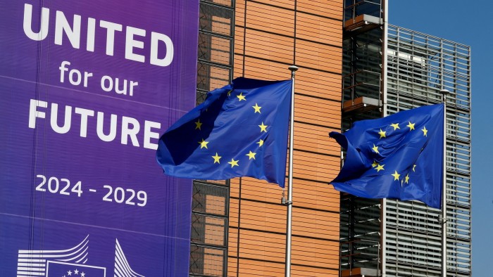 European Union flags fly outside the Berlaymont building in Brussels, Belgium